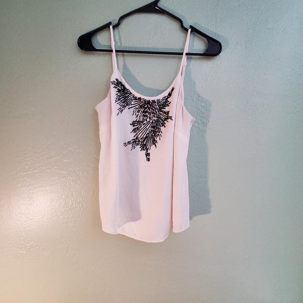 Elegant White Top with Black Embellishments